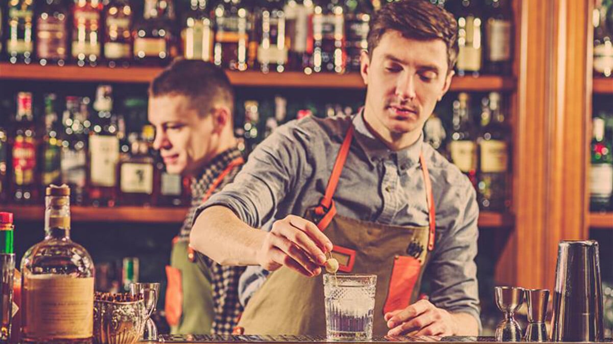 expert-barman-is-making-cocktail-night-club