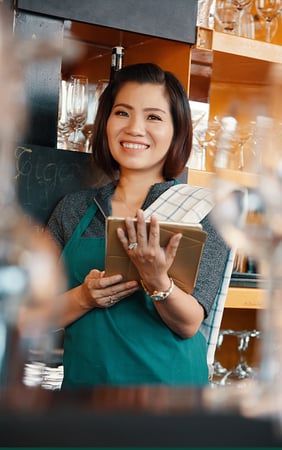 lady using recipe management software on her iPad