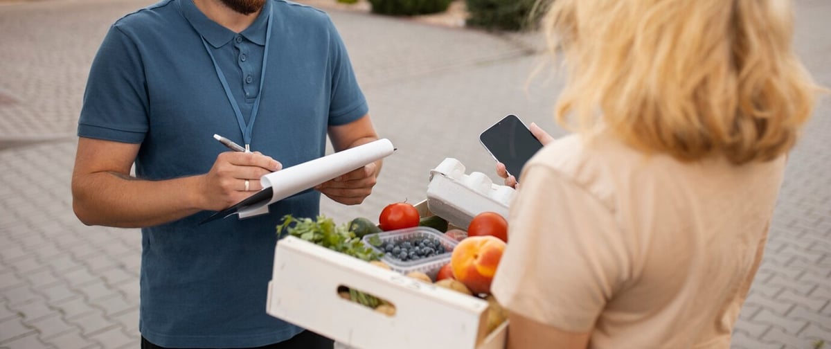 restaurant-worker-using-inventory-data-while-effectively-communicating-with-suppliers