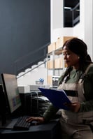 Woman working on optimizing inventory management and ordering